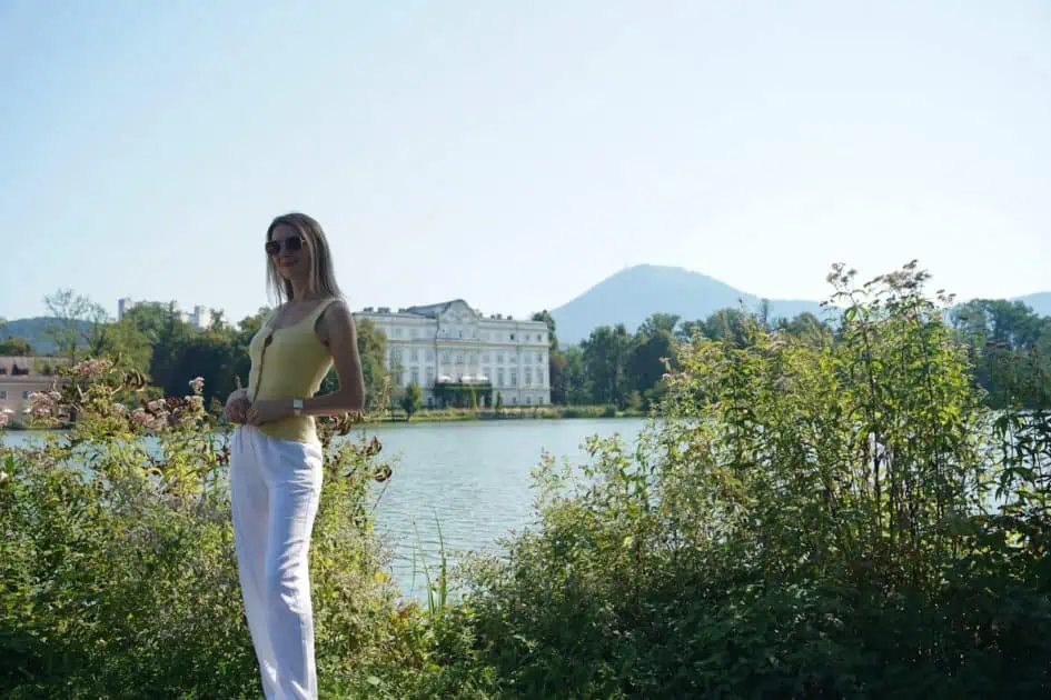 Lady in front of a "Sound of Music" Lakeside home in Salzburg 