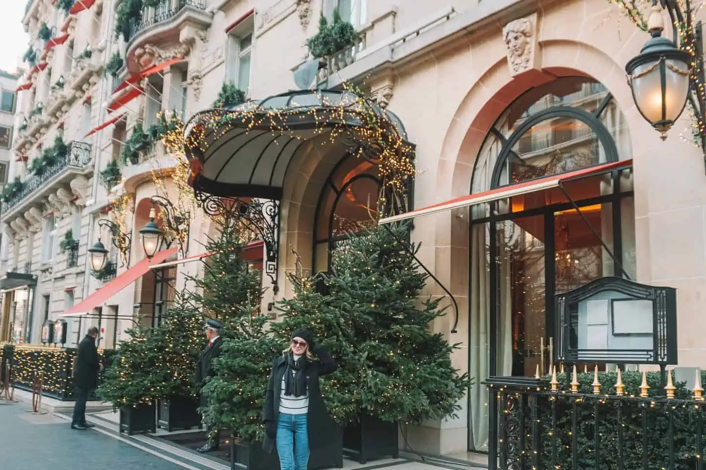 Girl standing at the front of Plaza Athenee Hotel Paris: One week in Paris