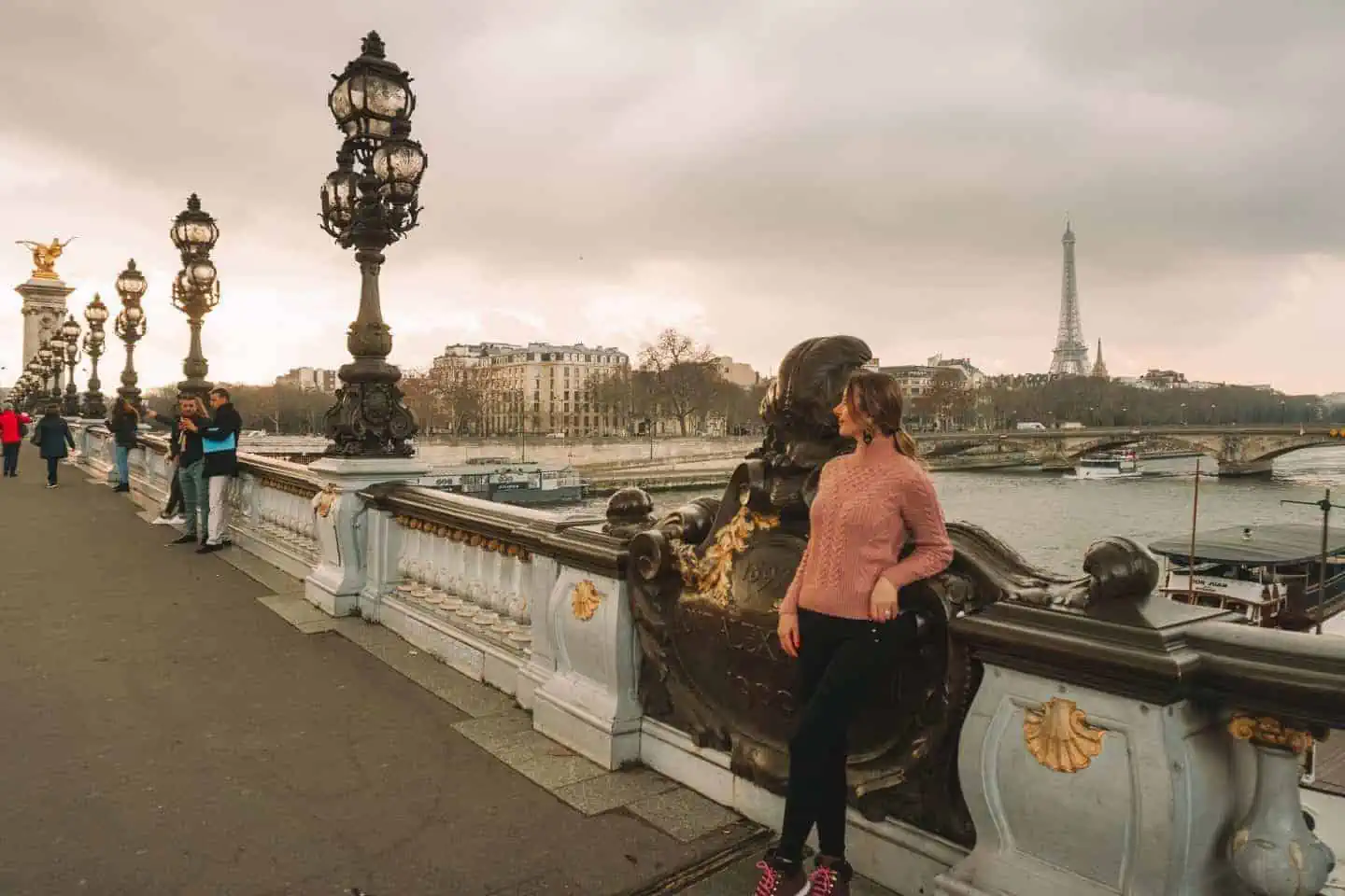 A week in Paris: Girl standing on the Pont Alexandre III bridge in Paris