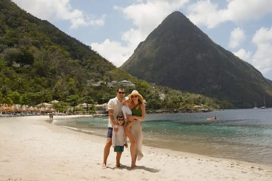 Father mother and two kids at Sugar Beach Viceroy Resort with the view of a Piton