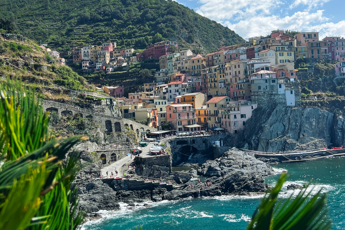 Manarola view capturing colorful houses on a cliff and a blue ocean